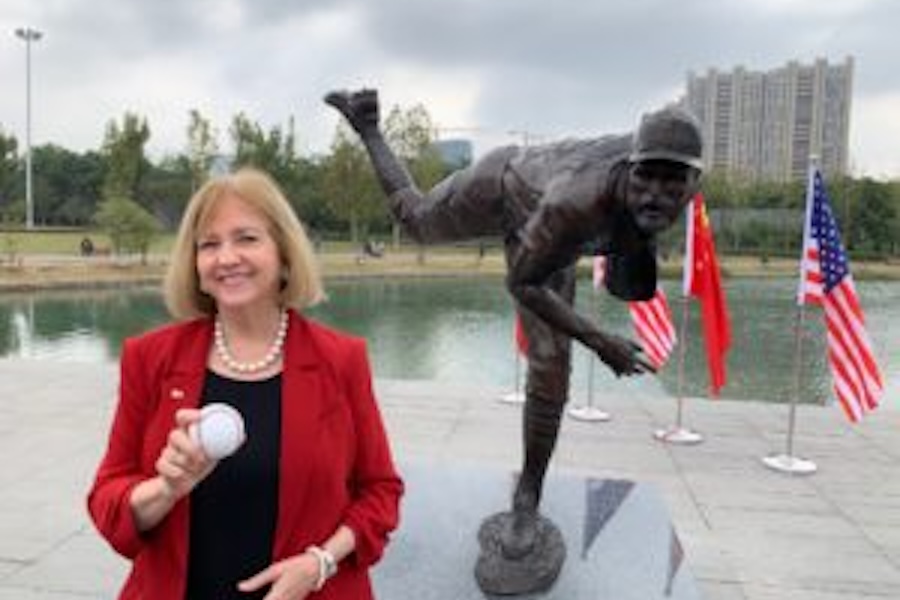 Image of Mayor Lyda Krewson gifts bronze statue of Cardinals player Adam Wainwright to St. Louis sister city Nanjing, China.