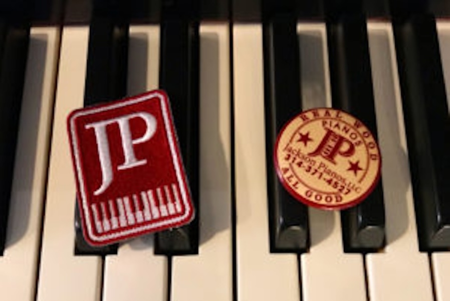 Image of two patches that say JP on top of Piano keys