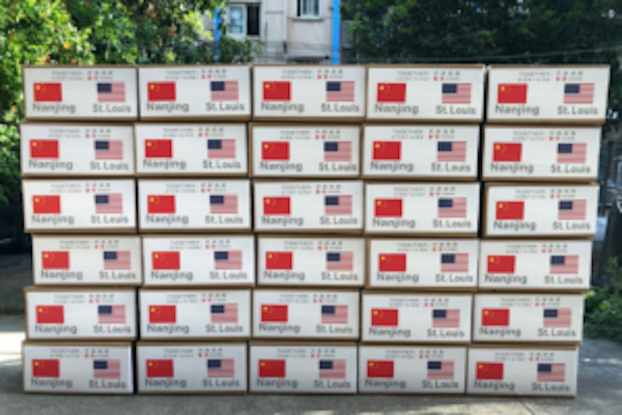 Image of 30 boxes of masks with the Chinese and American flag
