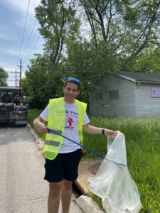 Zachary Berman of STL Partnership picks up trash