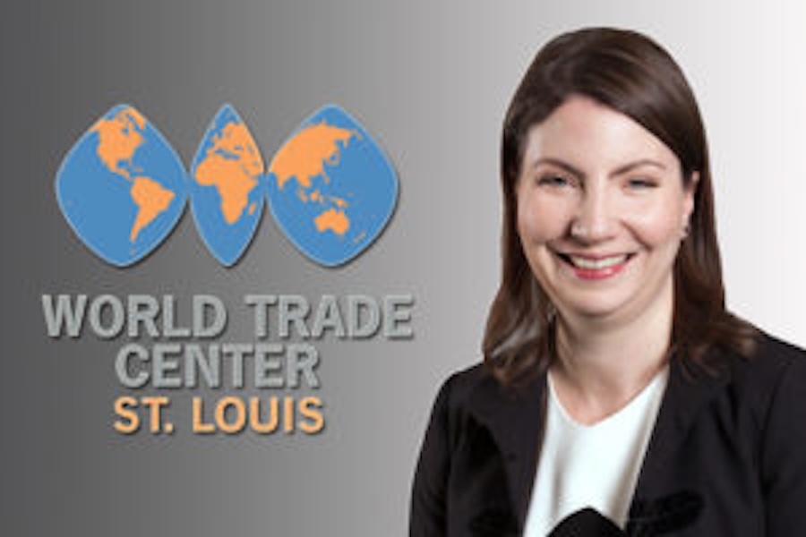 Image of Stella Sheehan next to the World Trade Center St. Louis logo