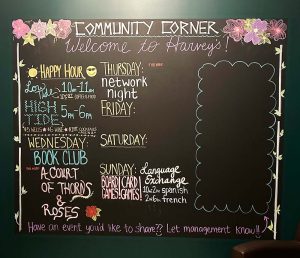 A chalkboard covered in a weekly events calendar