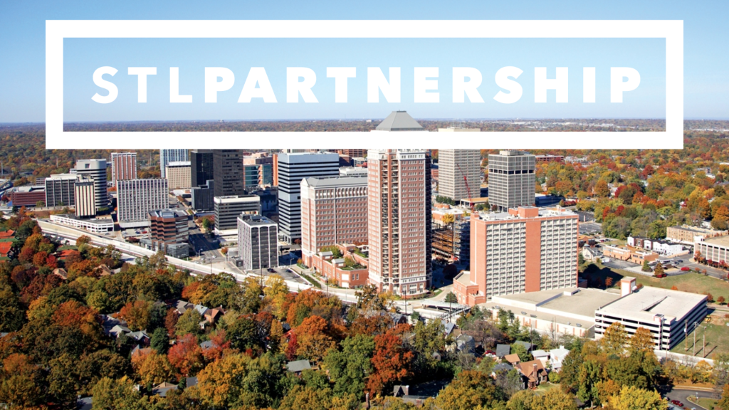 image of city's skyscrapers surrounded by trees with the STL Partnership superimposed over the top