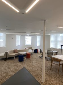 The inside of a building with many bright windows