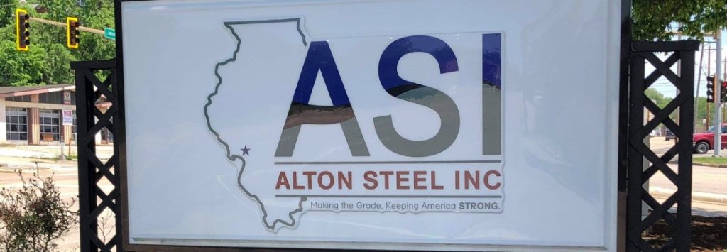 image of a white sign outdoors that says ASI Alton Steel Inc with the shape of Illinois