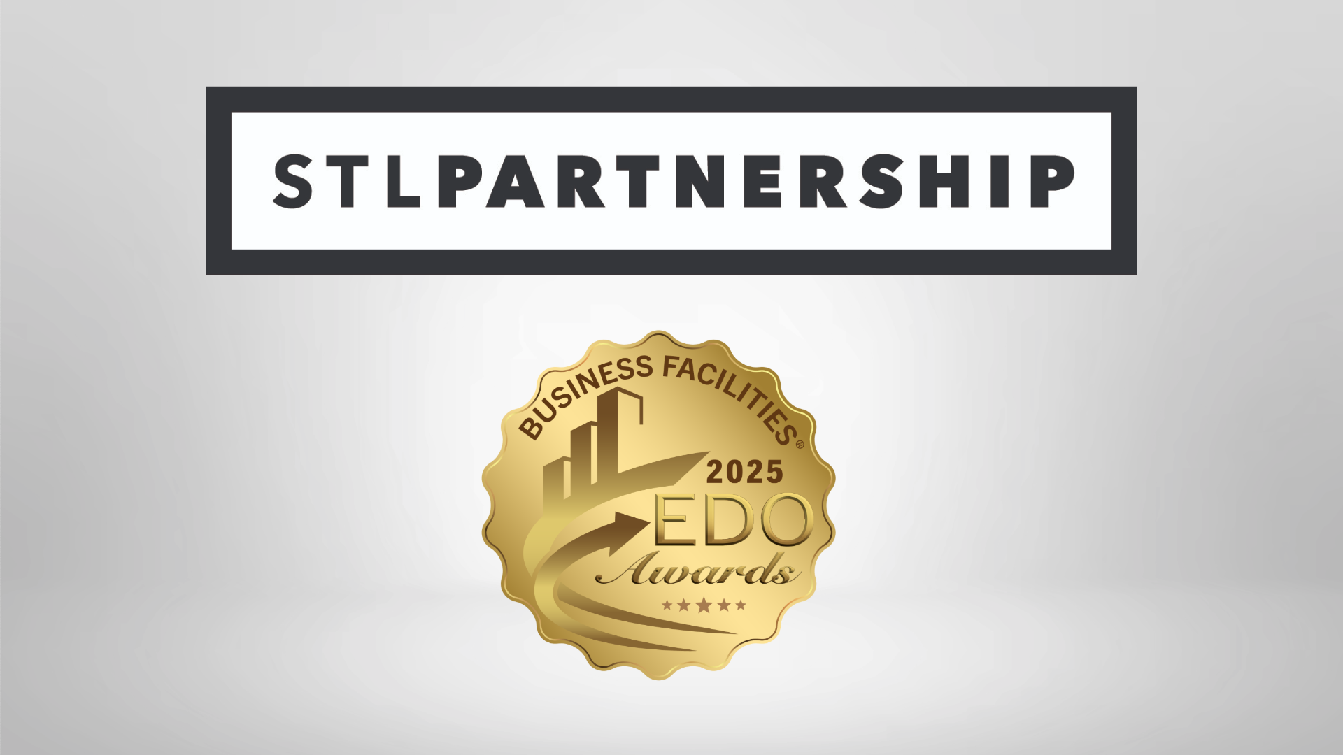 Logos of EDO Award (gold) and STL Partnership (black)
