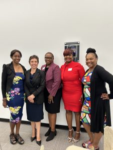 A group of women stand together