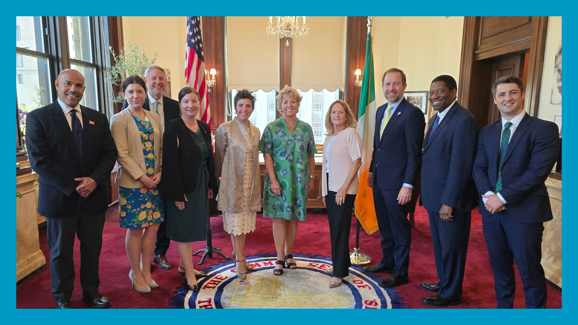 A group of people stand in the STL Mayor's office