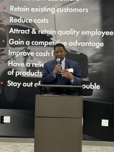 man speaks behind podium