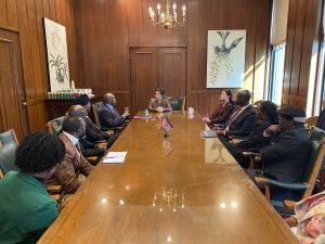 many people sit around a table