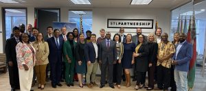 a group of people stand indoors