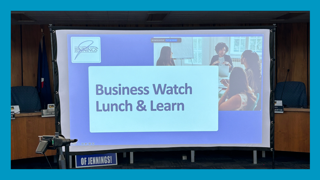 picture of a screen of a powerpoint that says Business Watch Lunch and Learn