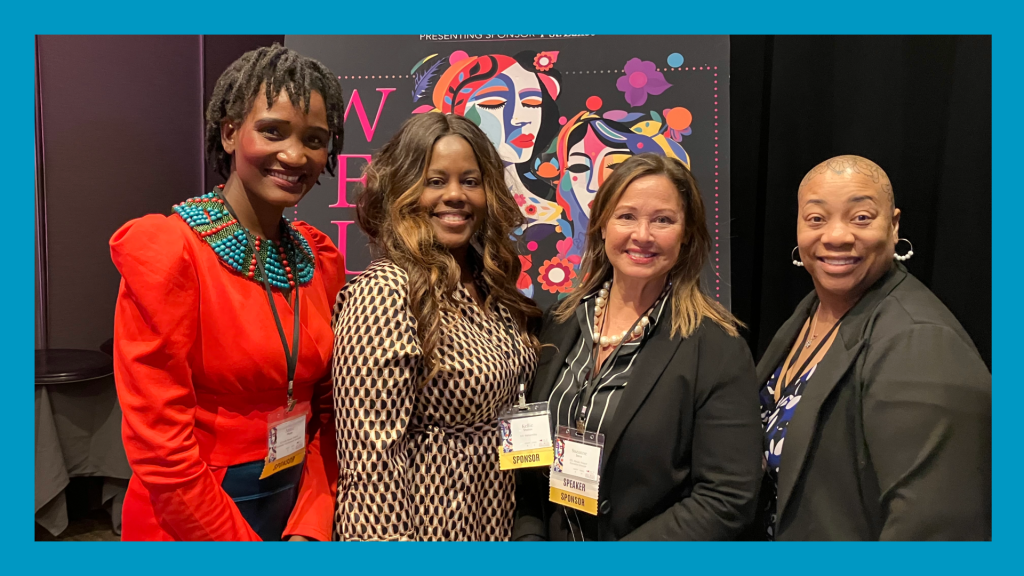 4 women pose for a picture with big smiles