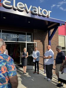 Founders speaking outside Elevator Building